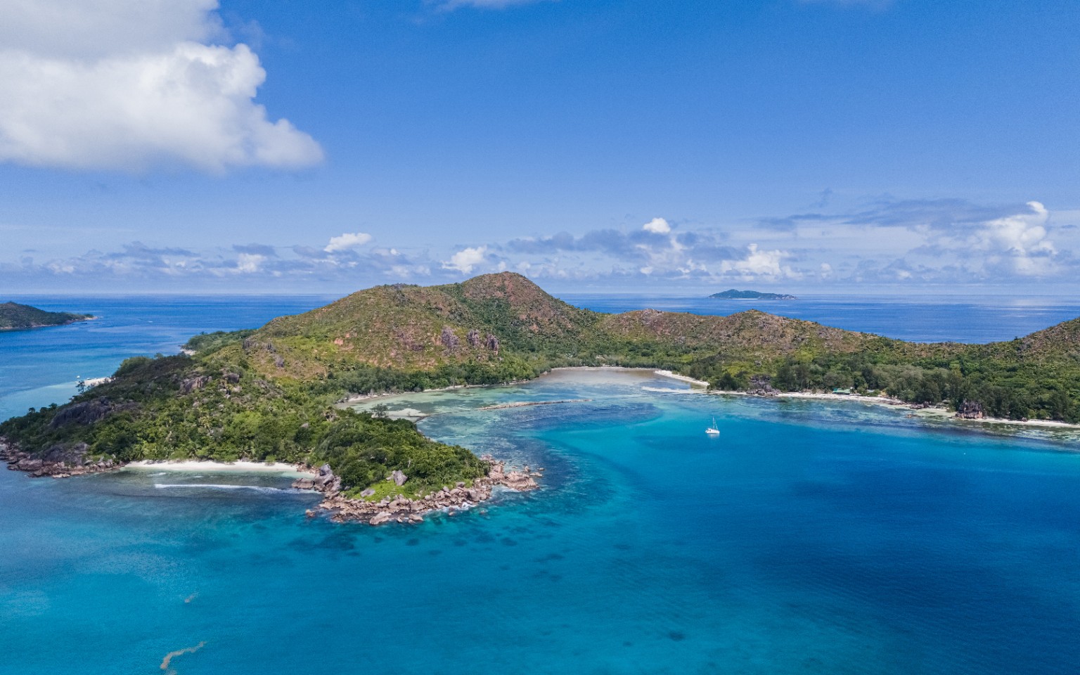 Curieuse Island coastline and granite rocks