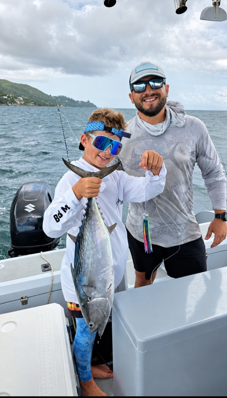 Guests with fishing catches at sunset